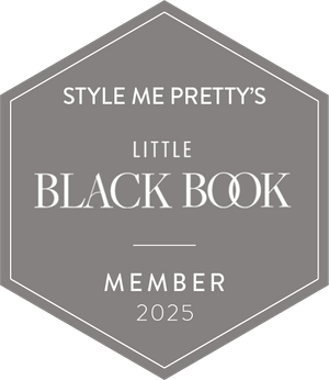 Gray hexagonal badge with the text "Style Me Pretty's Little Black Book Member 2025" in white, indicating membership.